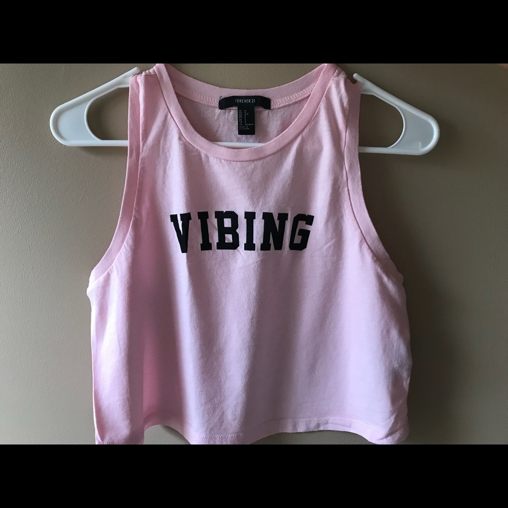 Pink crop top with “Vibing”  on the front